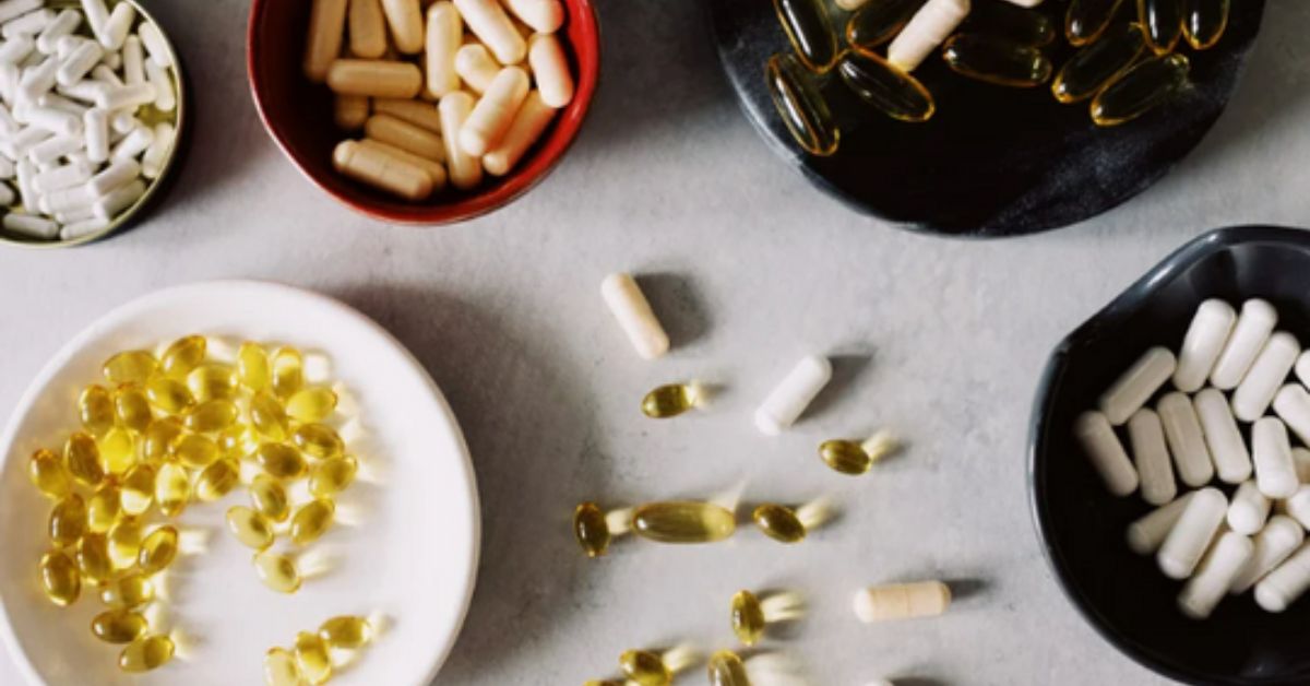 A table full of different supplements separated in tiny bowls.